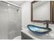 Modern bathroom featuring a unique sink, stylish mirror, and sleek glass-door shower at 1005 Caldon Dr, Stanley, NC 28164