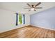 A bedroom with wood-look floors, a ceiling fan, and bright natural light at 1005 Caldon Dr, Stanley, NC 28164