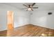 Spacious bedroom boasts hardwood floors and access to an en-suite bathroom at 1005 Caldon Dr, Stanley, NC 28164