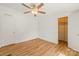 Bright bedroom featuring hardwood floors, ceiling fan, and ample closet space at 1005 Caldon Dr, Stanley, NC 28164