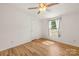 A bedroom with wood-look floors is bright with natural light at 1005 Caldon Dr, Stanley, NC 28164