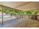 Large wooden deck with a view of the inviting backyard pool at 1005 Caldon Dr, Stanley, NC 28164