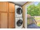 Convenient laundry room with stacked washer and dryer and exterior access at 1005 Caldon Dr, Stanley, NC 28164