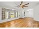 Bright living room features hardwood floors, large windows, and neutral color scheme at 1005 Caldon Dr, Stanley, NC 28164