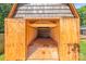 View inside storage shed featuring wood framing and shelving at 1005 Caldon Dr, Stanley, NC 28164