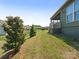 Manicured backyard with a lawn and plants complementing the house's aesthetic at 1026 Kirby Dr, Fort Mill, SC 29715