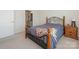 Bedroom featuring a cozy bed frame and easy access to a well-appointed bathroom at 1026 Kirby Dr, Fort Mill, SC 29715