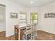 Dining area with wood floors, natural light, and a view of the backyard at 1026 Kirby Dr, Fort Mill, SC 29715
