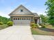 Charming single-Gathering home with a two-car garage, manicured landscaping, and a welcoming front facade at 1026 Kirby Dr, Fort Mill, SC 29715