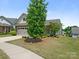 Charming home featuring manicured landscaping, a two-car garage, and a welcoming entrance at 1026 Kirby Dr, Fort Mill, SC 29715