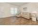 Cozy living room featuring a comfortable couch and ample natural light from the large window at 1026 Kirby Dr, Fort Mill, SC 29715