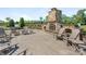 Outdoor stone fireplace surrounded by comfortable seating, perfect for gatherings and relaxation at 1026 Kirby Dr, Fort Mill, SC 29715