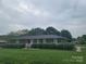Neat brick home with a manicured lawn and hedges, showcasing a tidy and welcoming exterior at 1165 Mt Moriah Church Rd, China Grove, NC 28023