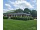 Quaint brick home with well-maintained lawn, complemented by neatly trimmed shrubbery and inviting entrance at 1165 Mt Moriah Church Rd, China Grove, NC 28023
