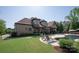 Beautiful backyard features an in-ground pool, patio, and grassy space at 1304 Lookout Cir, Waxhaw, NC 28173