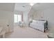 Serene bedroom featuring a daybed, a cozy chair, and ample natural light at 1304 Lookout Cir, Waxhaw, NC 28173