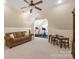 Bright bonus room with a ceiling fan, a sitting area, an exercise area, and a table for children at 1304 Lookout Cir, Waxhaw, NC 28173