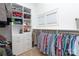 Organized walk-in closet with custom shelving and rods for ample storage at 1304 Lookout Cir, Waxhaw, NC 28173
