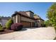 Exterior shot of a brick home featuring a three-car garage and driveway at 1304 Lookout Cir, Waxhaw, NC 28173