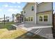 Backyard with fire pit, concrete patio and screened in porch on the house at 1308 Stone Marker Dr, Monroe, NC 28112