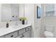 Modern bathroom featuring a sleek vanity, framed mirror, and toilet at 1308 Stone Marker Dr, Monroe, NC 28112