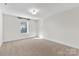 Spacious bedroom featuring neutral carpet, one window, and base trim at 1308 Stone Marker Dr, Monroe, NC 28112