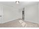 Bedroom featuring neutral carpet, open closet, and painted trim at 1308 Stone Marker Dr, Monroe, NC 28112
