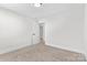 Serene bedroom featuring neutral carpet, an open door, and ample natural light at 1308 Stone Marker Dr, Monroe, NC 28112