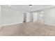 Spacious bedroom features neutral carpet, trim, and fresh paint, and three entryways to other rooms at 1308 Stone Marker Dr, Monroe, NC 28112