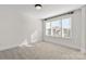 Bedroom featuring neutral carpet, lots of light, and white walls at 1308 Stone Marker Dr, Monroe, NC 28112