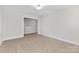 Spacious bedroom featuring neutral carpet, bright window, and trim at 1308 Stone Marker Dr, Monroe, NC 28112