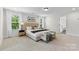 Bright main bedroom with a luxurious bed and bench at 1308 Stone Marker Dr, Monroe, NC 28112