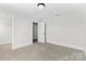 Bedroom with neutral carpet, open closet, and white painted trim at 1308 Stone Marker Dr, Monroe, NC 28112