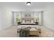 Bright main bedroom with a luxurious bed and bench at 1308 Stone Marker Dr, Monroe, NC 28112