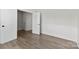 Bedroom with light wood flooring, paneled walls, and white trim at 1308 Stone Marker Dr, Monroe, NC 28112