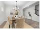 Dining room featuring a modern chandelier and seating for six at 1308 Stone Marker Dr, Monroe, NC 28112