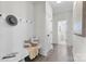 Inviting entryway with bench, coat hooks, and access to a half bathroom at 1308 Stone Marker Dr, Monroe, NC 28112