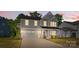 Charming two-story home with a manicured lawn and an attached two-car garage at 1308 Stone Marker Dr, Monroe, NC 28112