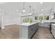 Spacious kitchen with a large island, pendant lighting, and stainless steel appliances at 1308 Stone Marker Dr, Monroe, NC 28112