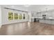 Open floor plan seamlessly connecting the living space and a modern kitchen with stainless steel appliances at 1308 Stone Marker Dr, Monroe, NC 28112