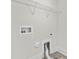 Laundry room area showcasing hookups and wire rack shelving above at 1308 Stone Marker Dr, Monroe, NC 28112