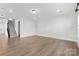 Spacious living area with staircase and wood-look floors, perfect for entertaining at 1308 Stone Marker Dr, Monroe, NC 28112