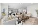 Bright, open-concept living room flowing into the kitchen, perfect for entertaining at 1308 Stone Marker Dr, Monroe, NC 28112