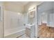 Well-lit bathroom featuring a tub and shower combination and vanity at 146 Walnut St, Chester, SC 29706
