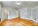 Bedroom with two doorways, hardwood floors, and ample natural light at 146 Walnut St, Chester, SC 29706