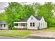 Charming home with a covered porch, white siding, and a well-maintained lawn at 146 Walnut St, Chester, SC 29706