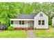 Charming single-story home with covered front porch and brick foundation at 146 Walnut St, Chester, SC 29706