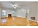 Bright living room with hardwood floors, fireplace, and abundant natural light at 146 Walnut St, Chester, SC 29706