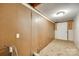 Interior room featuring an electrical outlet, tan walls, and a white exterior door at 146 Walnut St, Chester, SC 29706
