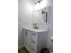 Modern bathroom featuring a white vanity with black fixtures, a stylish mirror, and tiled flooring at 149 Glenwood Dr, Rock Hill, SC 29732